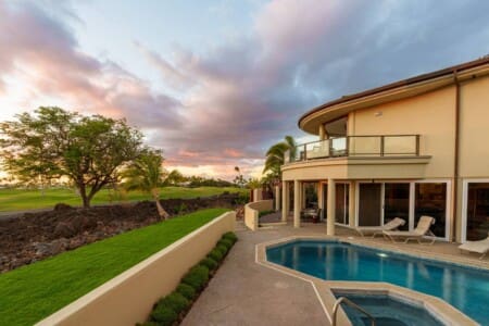 Private pool and spa at Hale Mele overlooking the Mauna Lani golf course at sunset on the Big Island of Hawaii.
