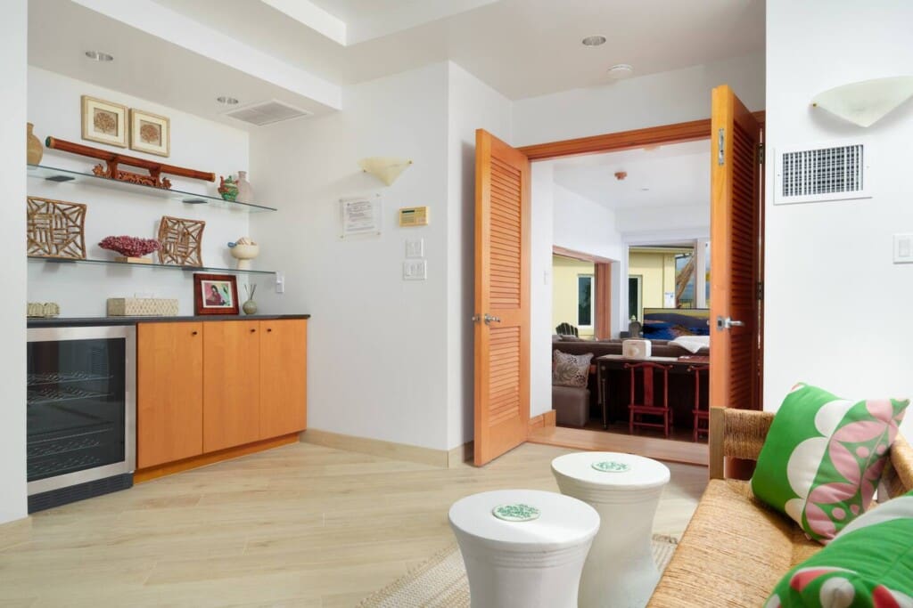 Primary suite sitting area with refreshment center and mini fridge at Hale Mele luxury vacation rental in Mauna Lani.