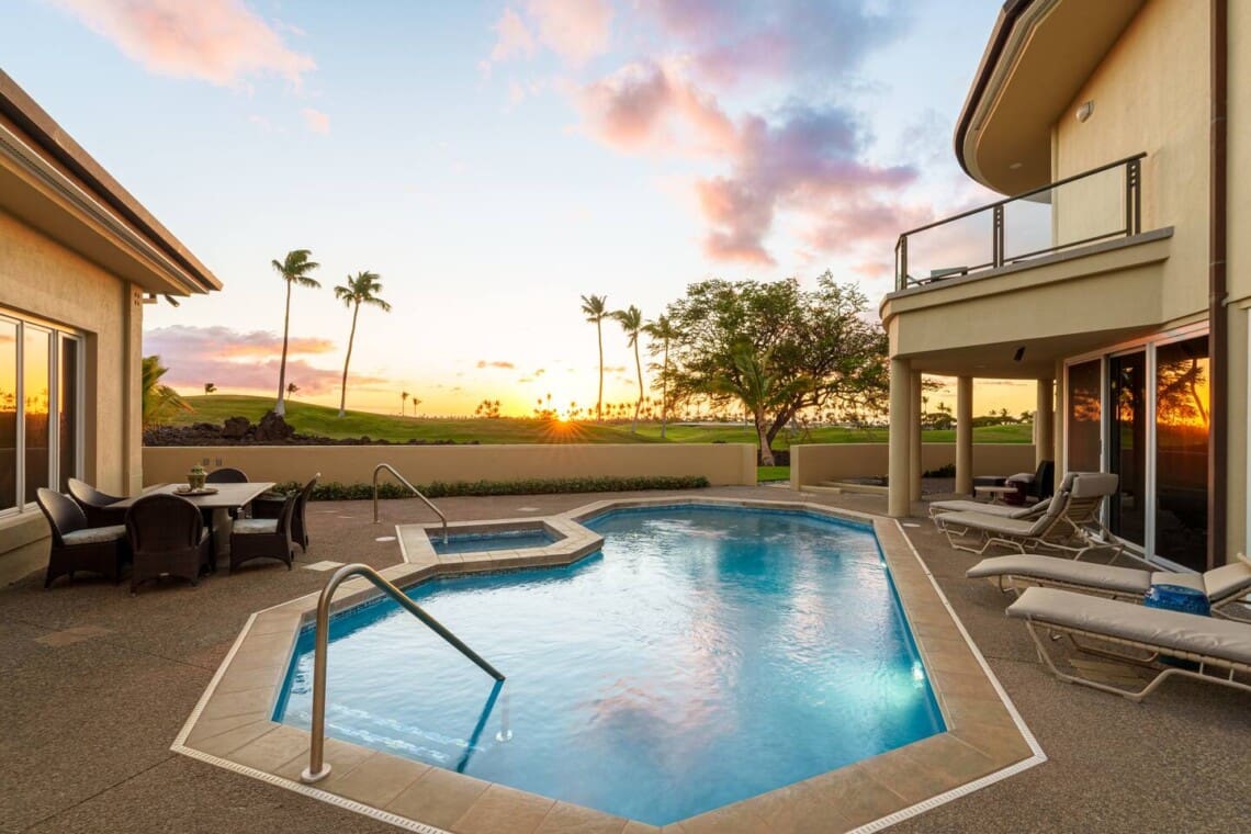 Private pool and spa at Hale Mele with sunset views across the Mauna Lani golf course.